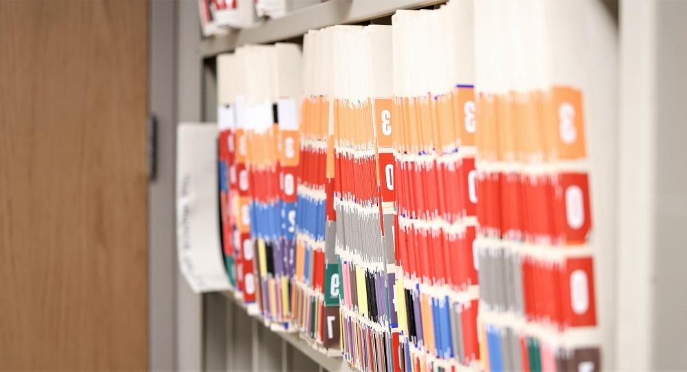 Numbered file folders on an office shelf